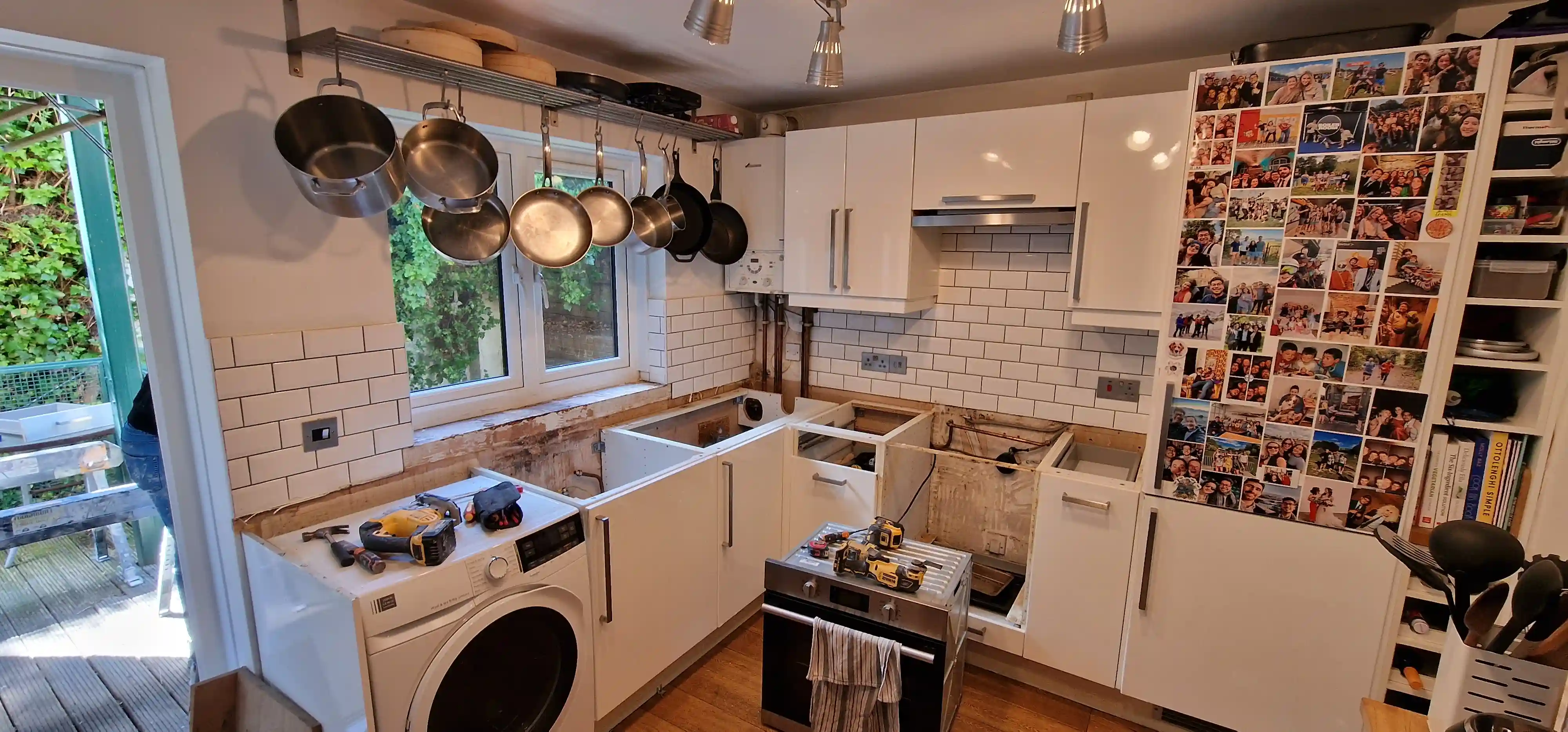 Existing laminate worktop being removed from retained kitchen cabinets in London