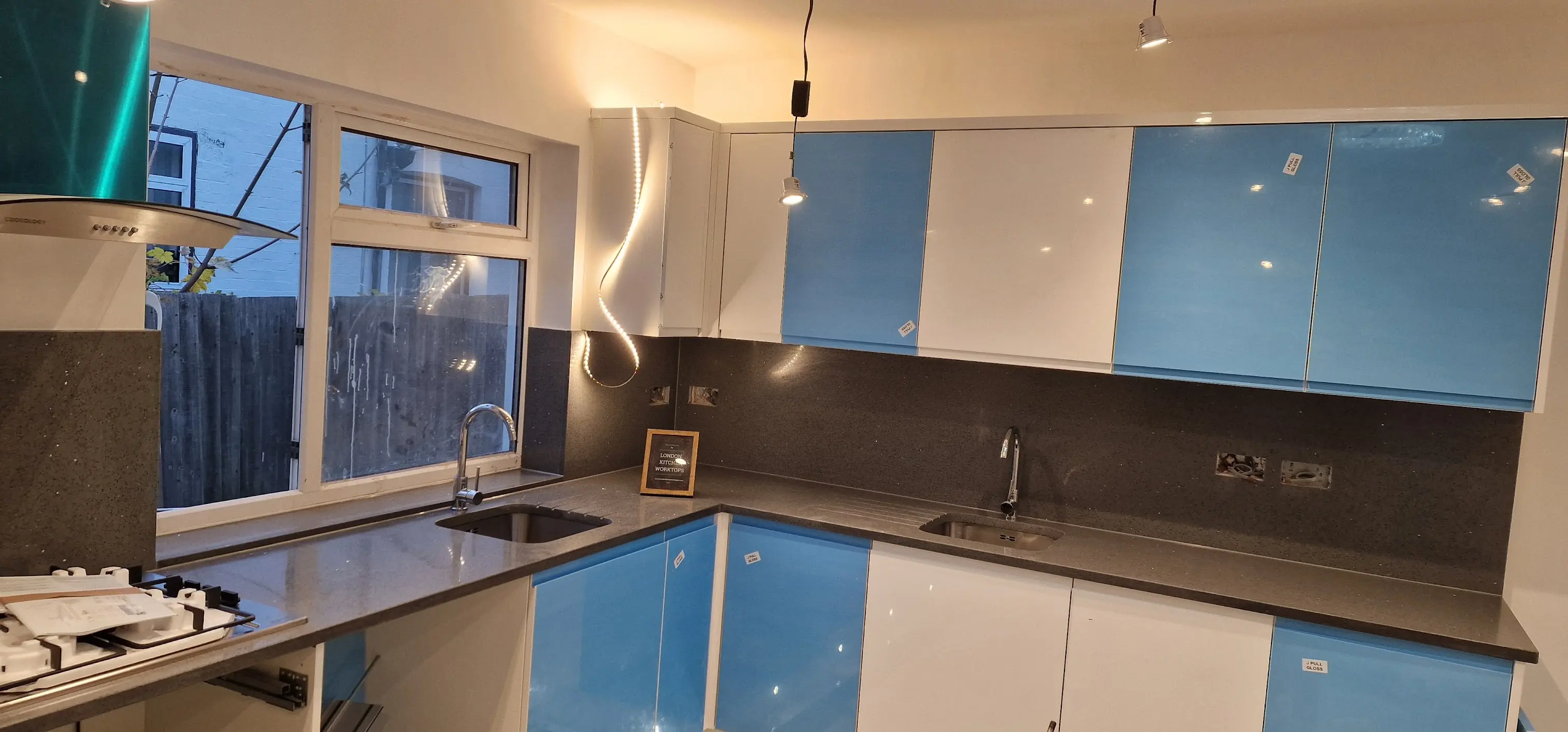 Grey quartz worktops Ealing Grey quartz worktops fitted in an Ealing family kitchen