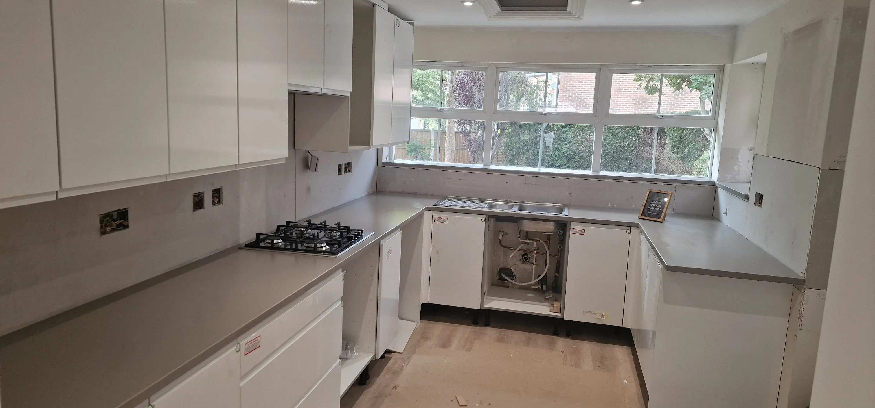 Grey quartz worktops in a contemporary Greenford kitchen