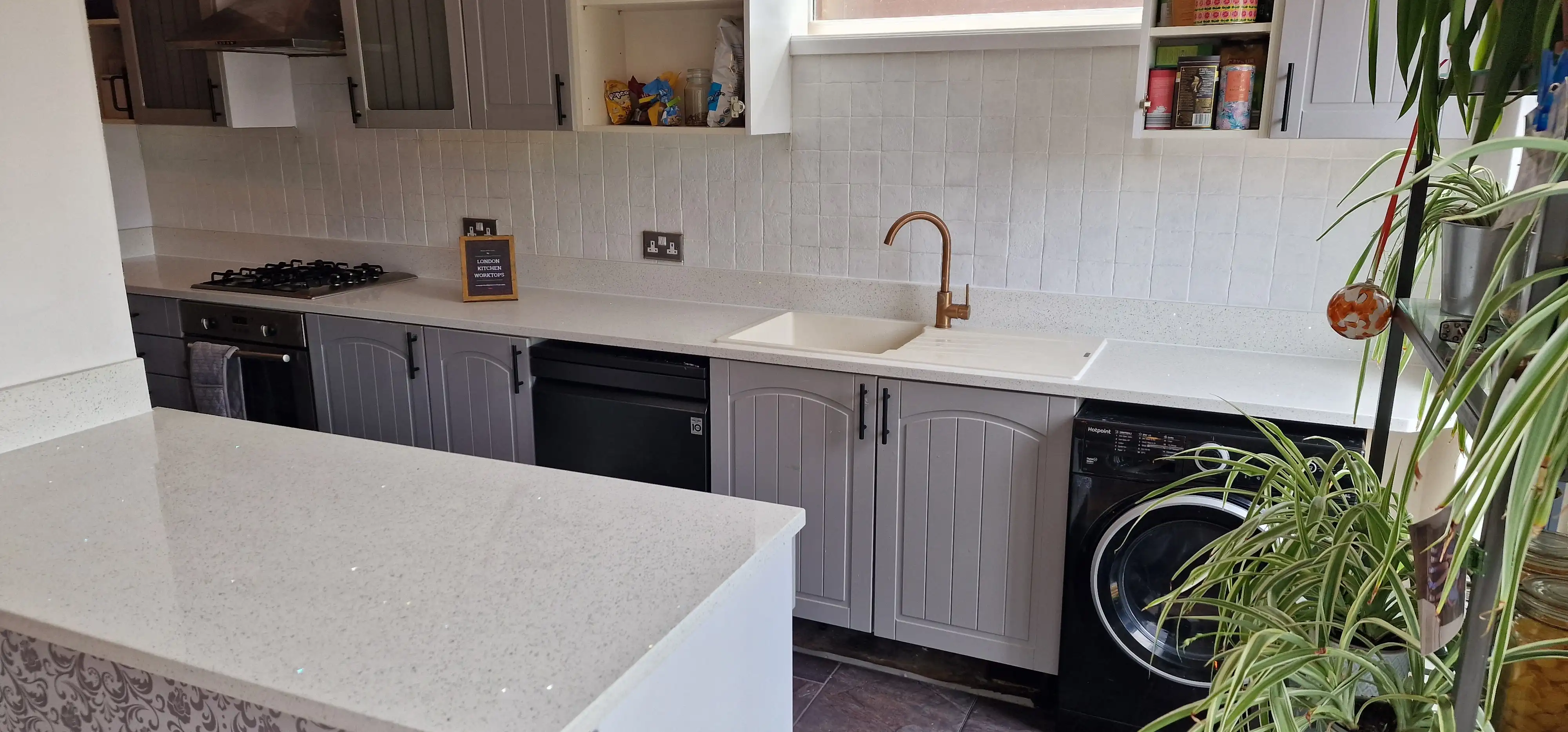 New worktops for an existing kitchen New quartz worktops fitted to retained existing kitchen cabinets in London