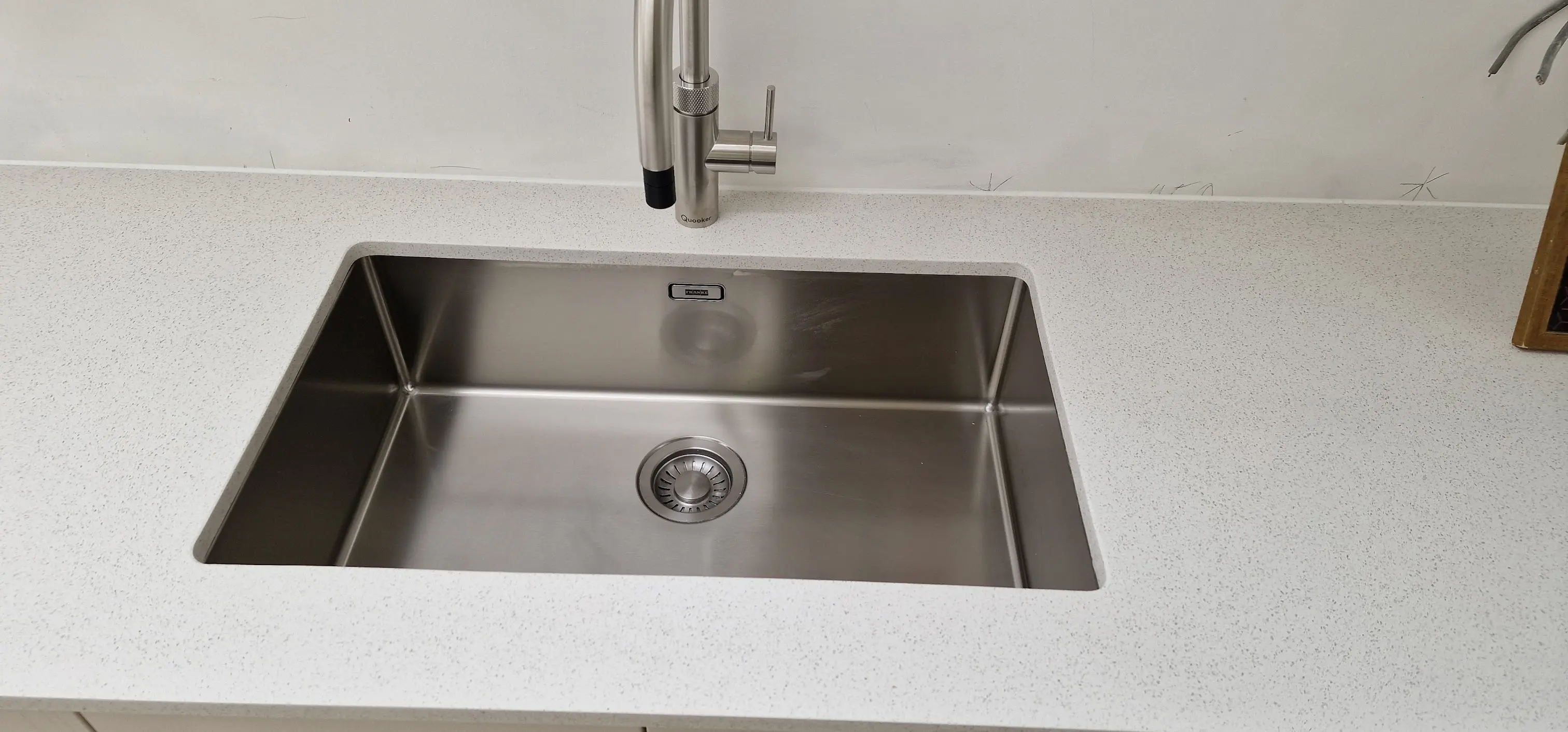 Quartz worktop with undermount sink cut-out during installation in Northwood