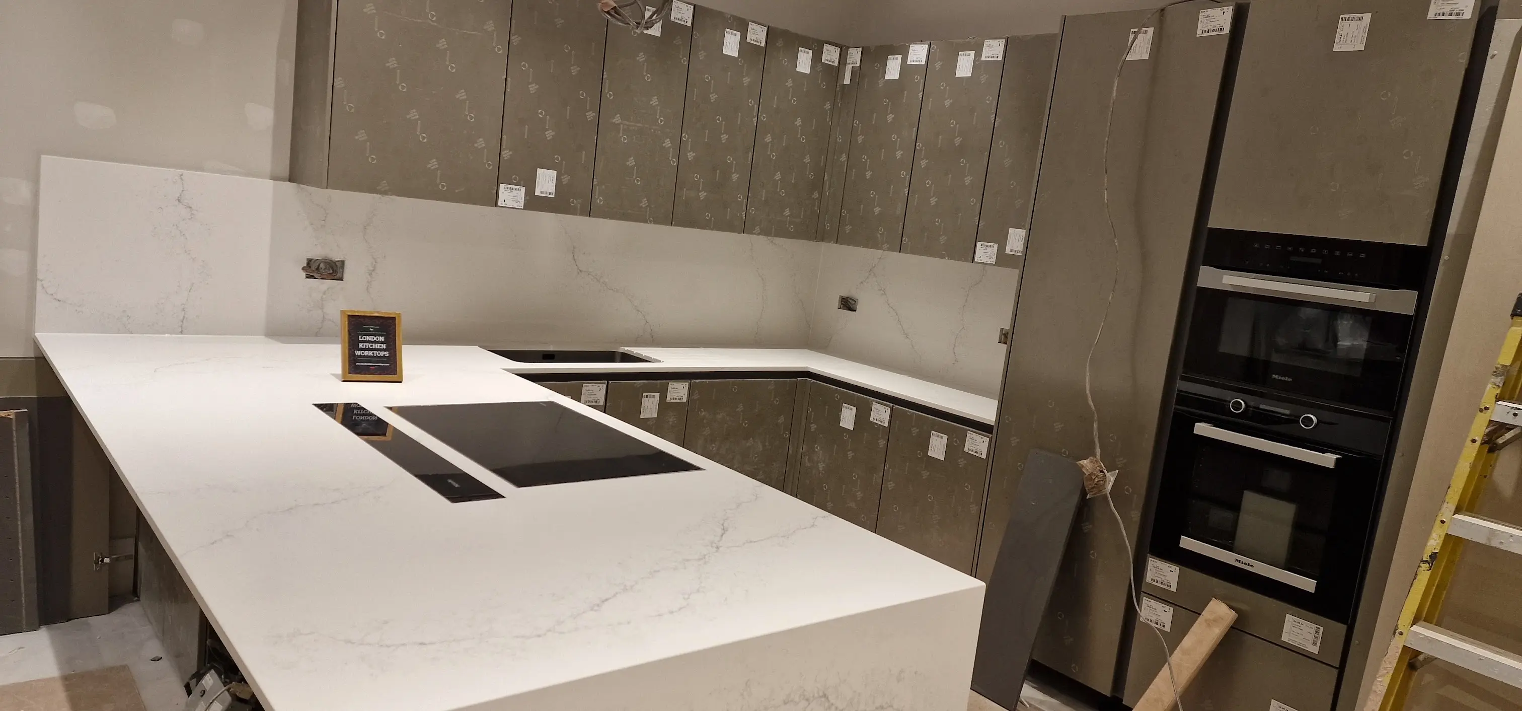 Quartz worktops fitted in an Arborfield Green new-build kitchen with undermount sink