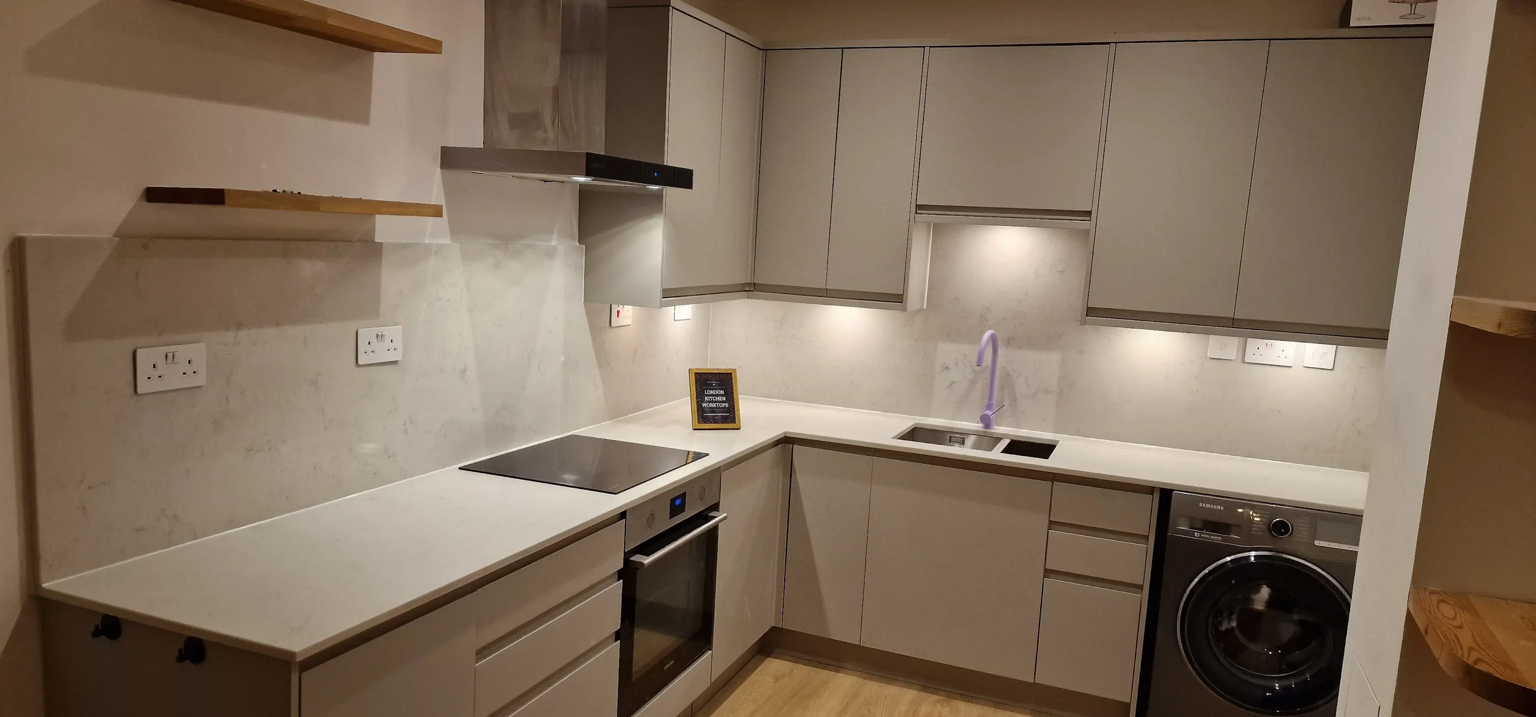 White quartz worktops in a Beckenham shaker kitchen with clean polished finish