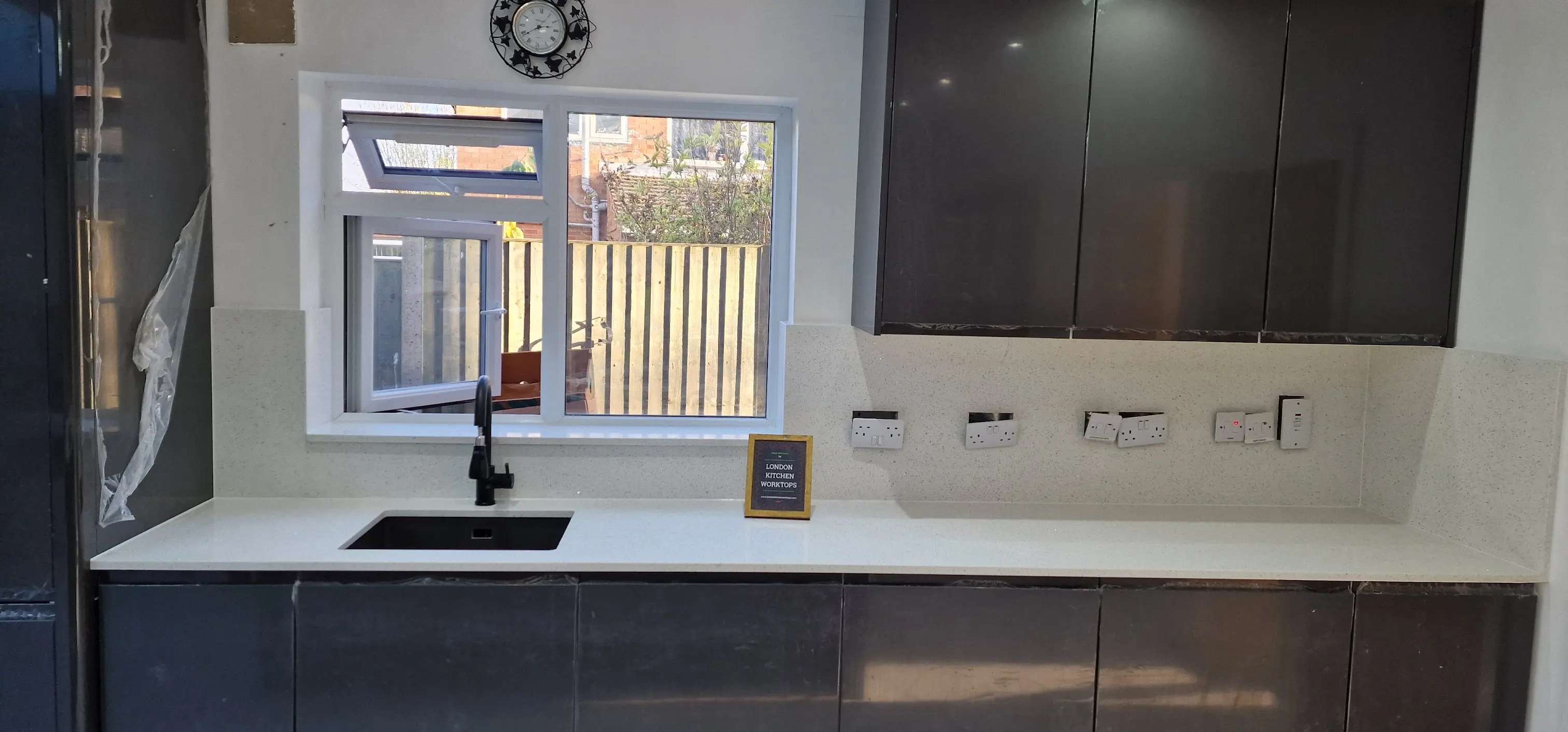 Quartz worktops in a Carshalton Beeches shaker kitchen