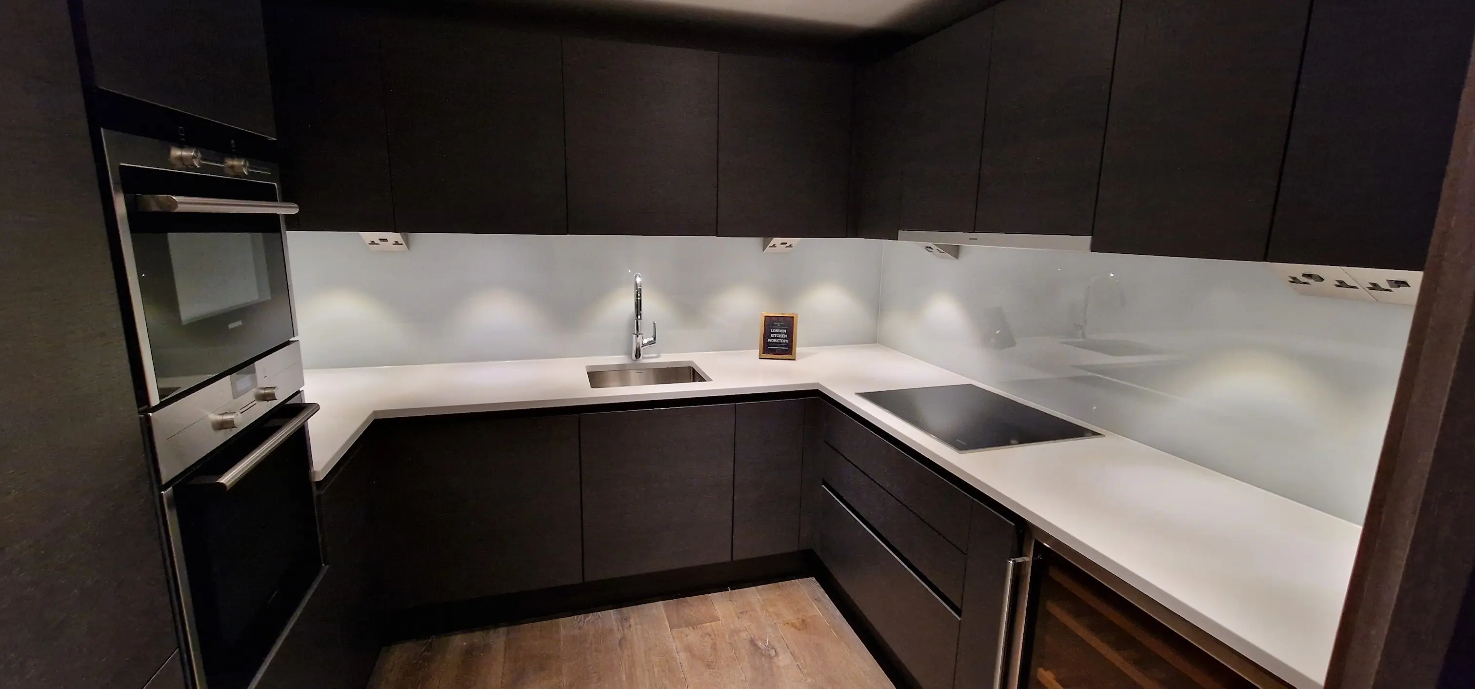 Light quartz worktop installed in a compact Colchester kitchen