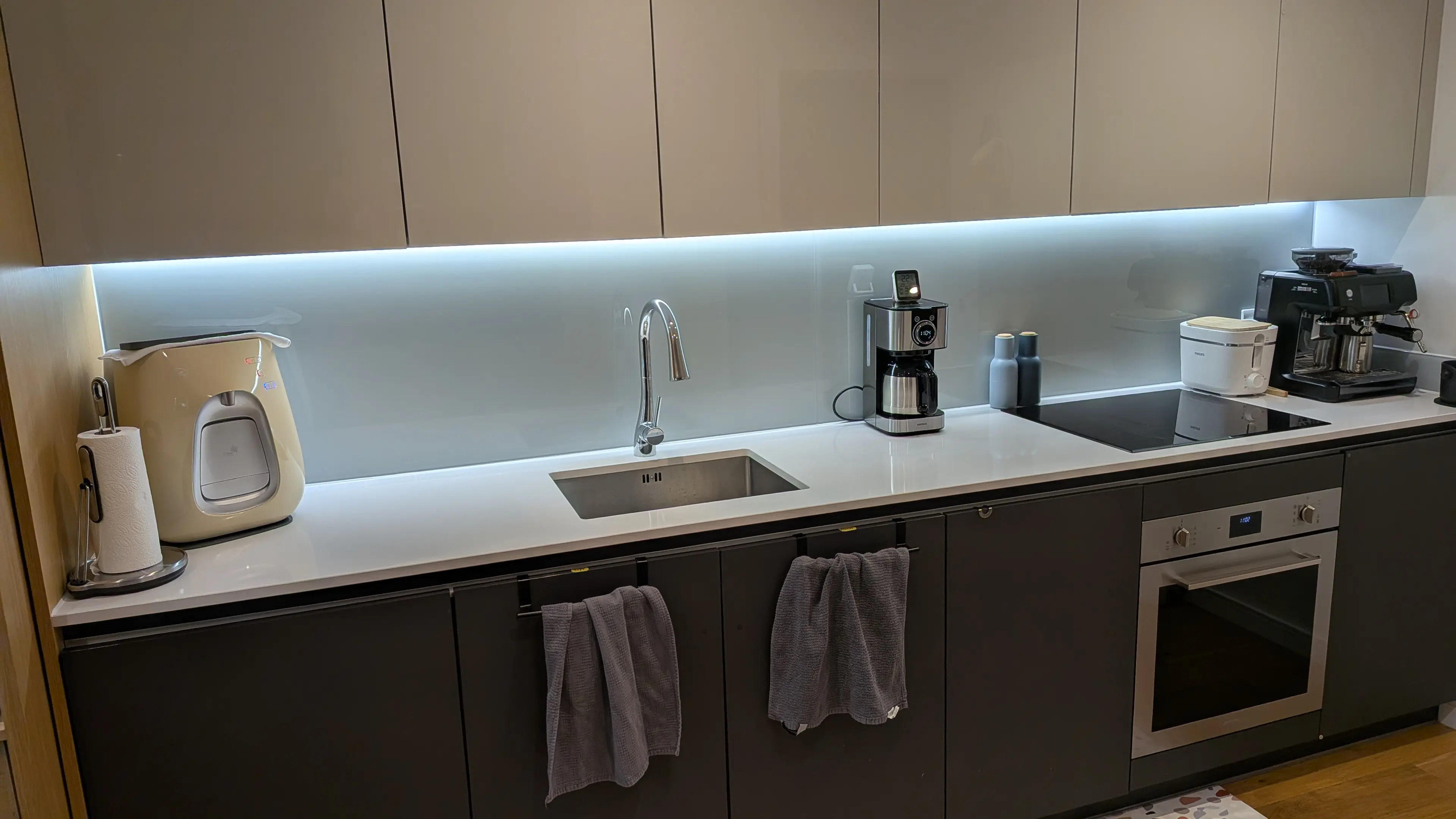 Light quartz worktops in a Brook Green family kitchen