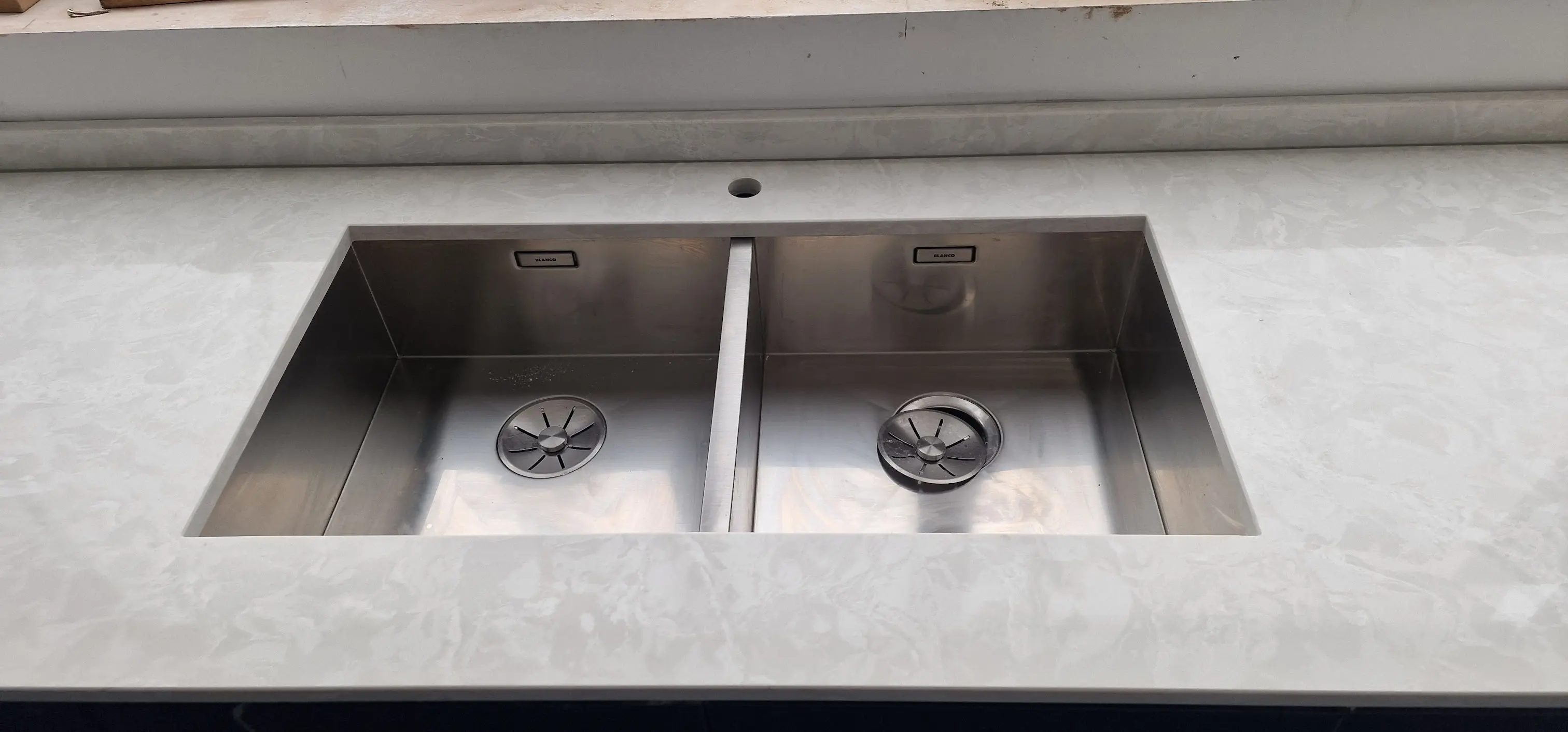 Undermount sink cut-out fabricated into a quartz worktop for a High Wycombe project