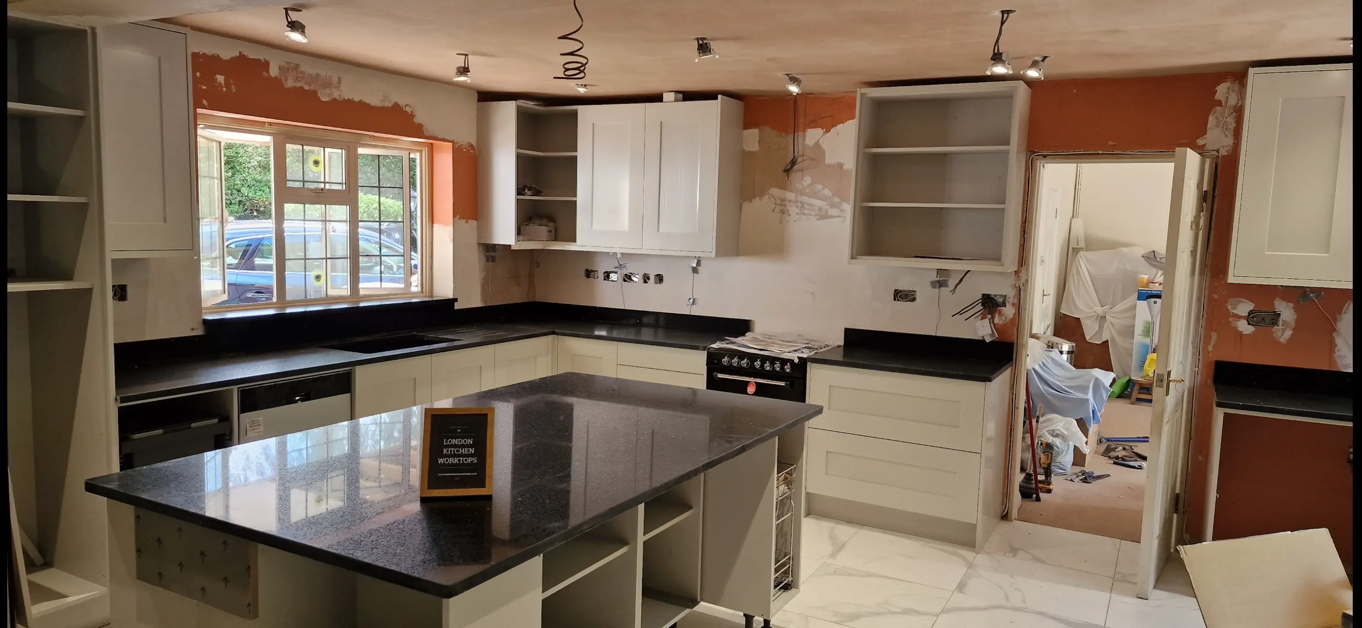 Black quartz island worktop with polished edge detail