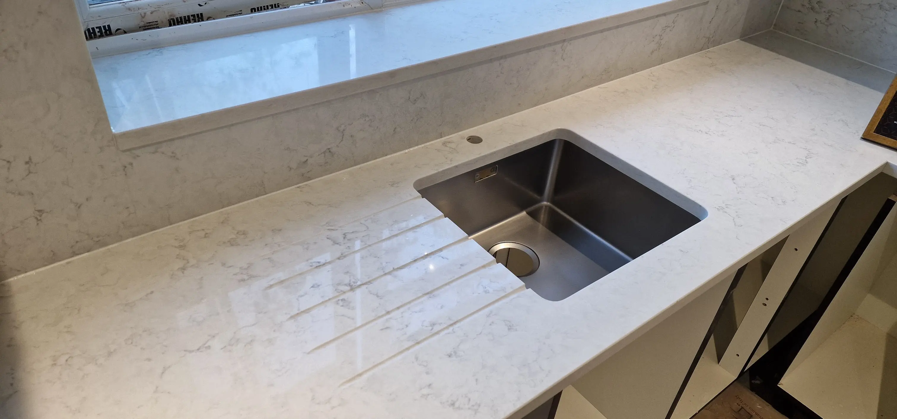 Quartz sink cut-out detail in Kew Undermount sink cut-out detail in a quartz worktop fitted in Kew