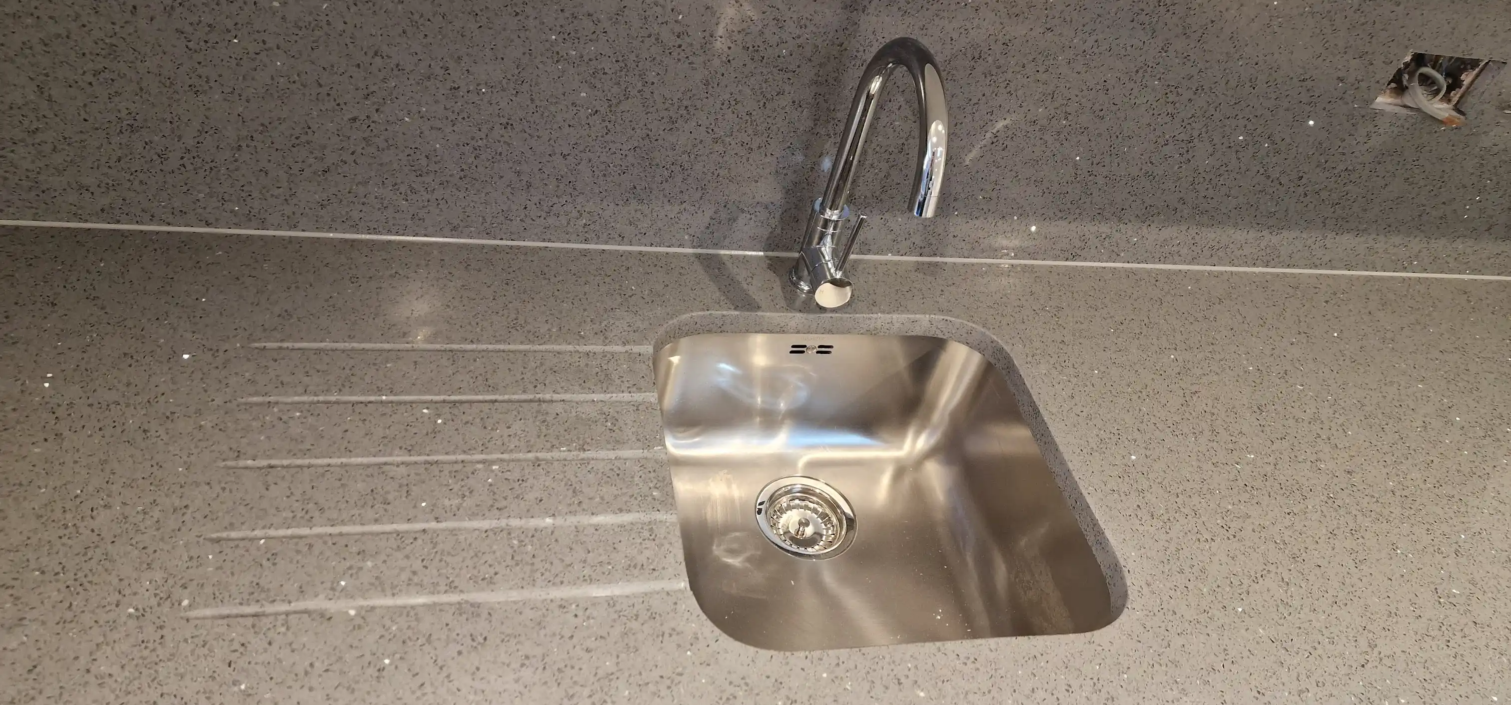Quartz worktop with undermount sink and precise cut-out detail