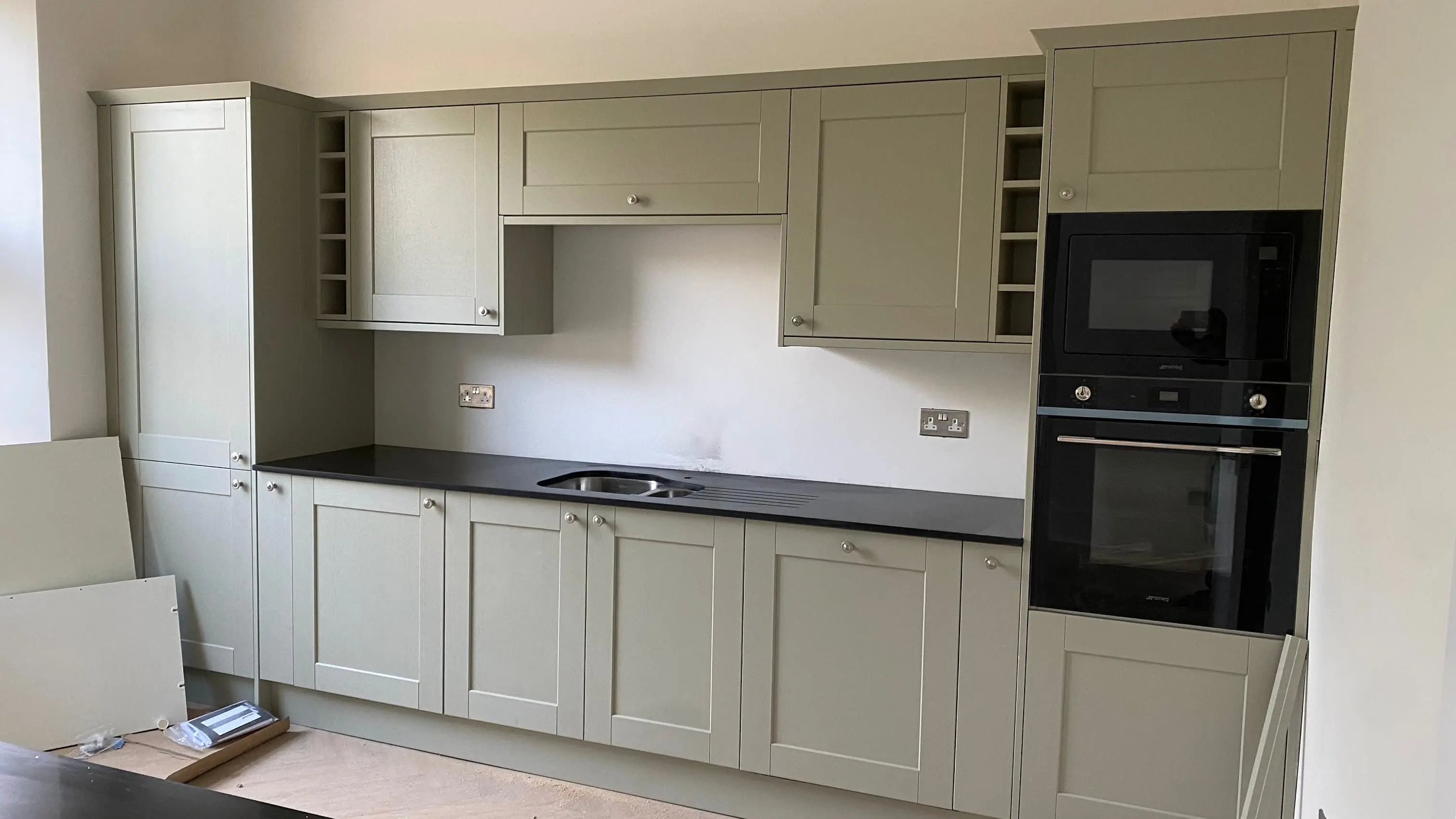 Quartz worktops in a Newbury detached home kitchen with full-length surface run
