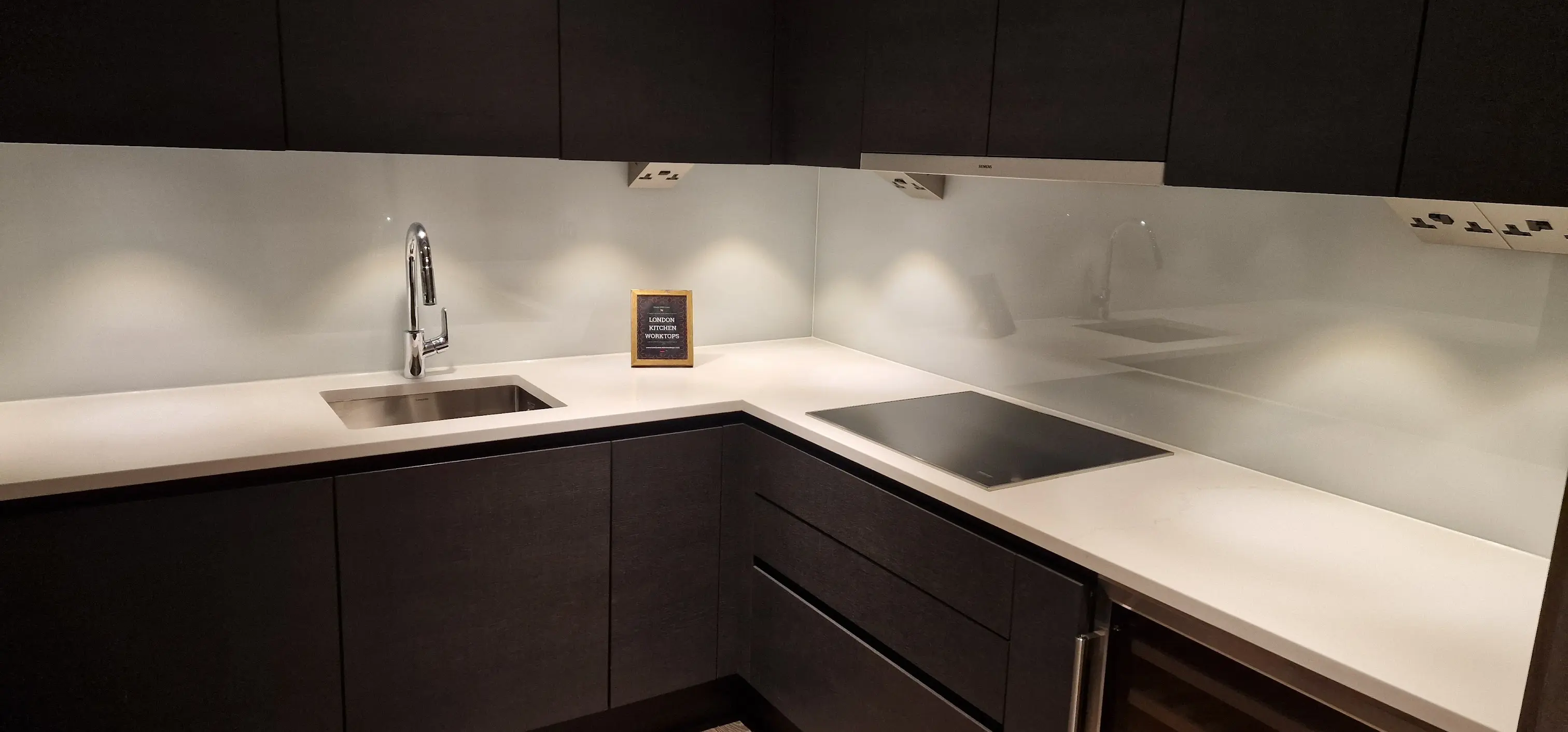 White Quartz Worktops Park Royal White quartz worktops fitted in an L-shaped kitchen in Park Royal