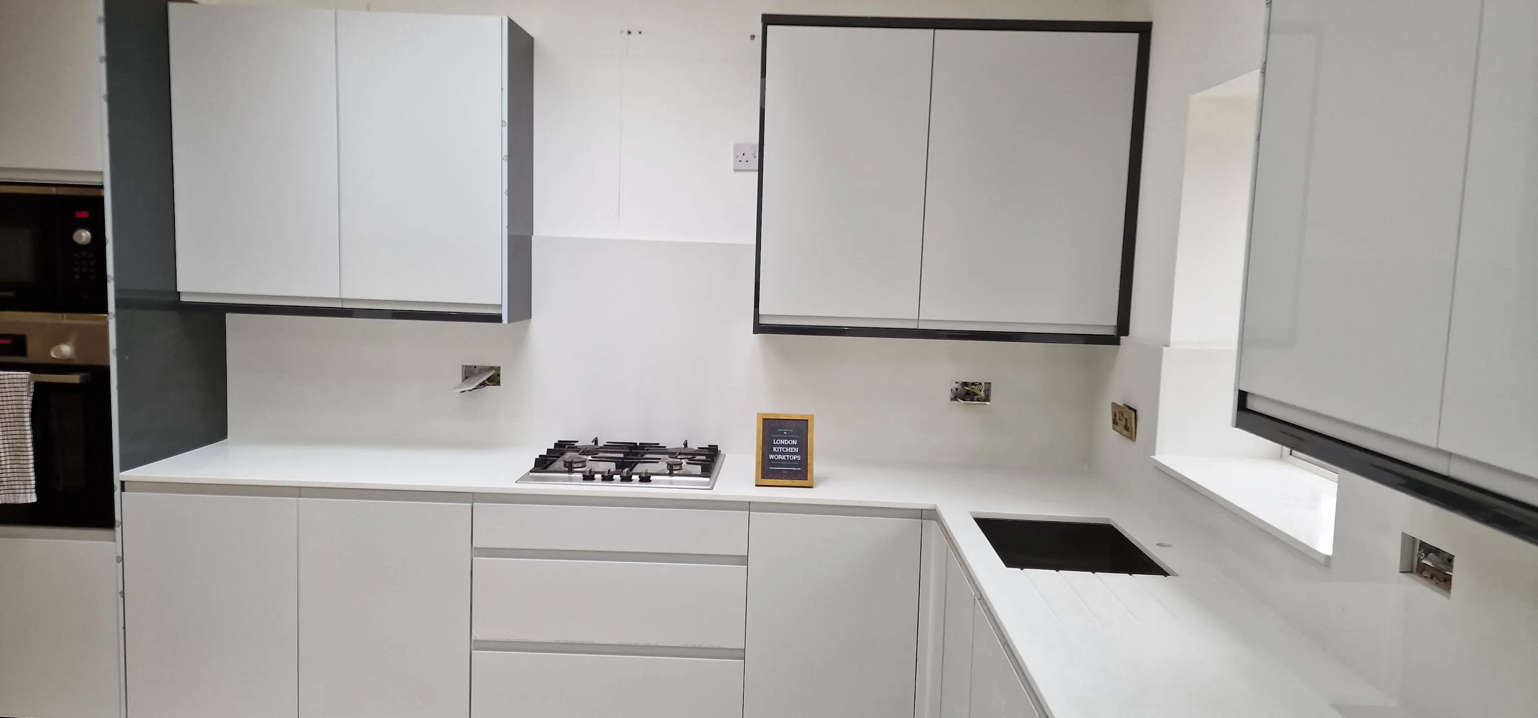 White quartz worktops in a Reading galley kitchen designed for a compact terrace layout