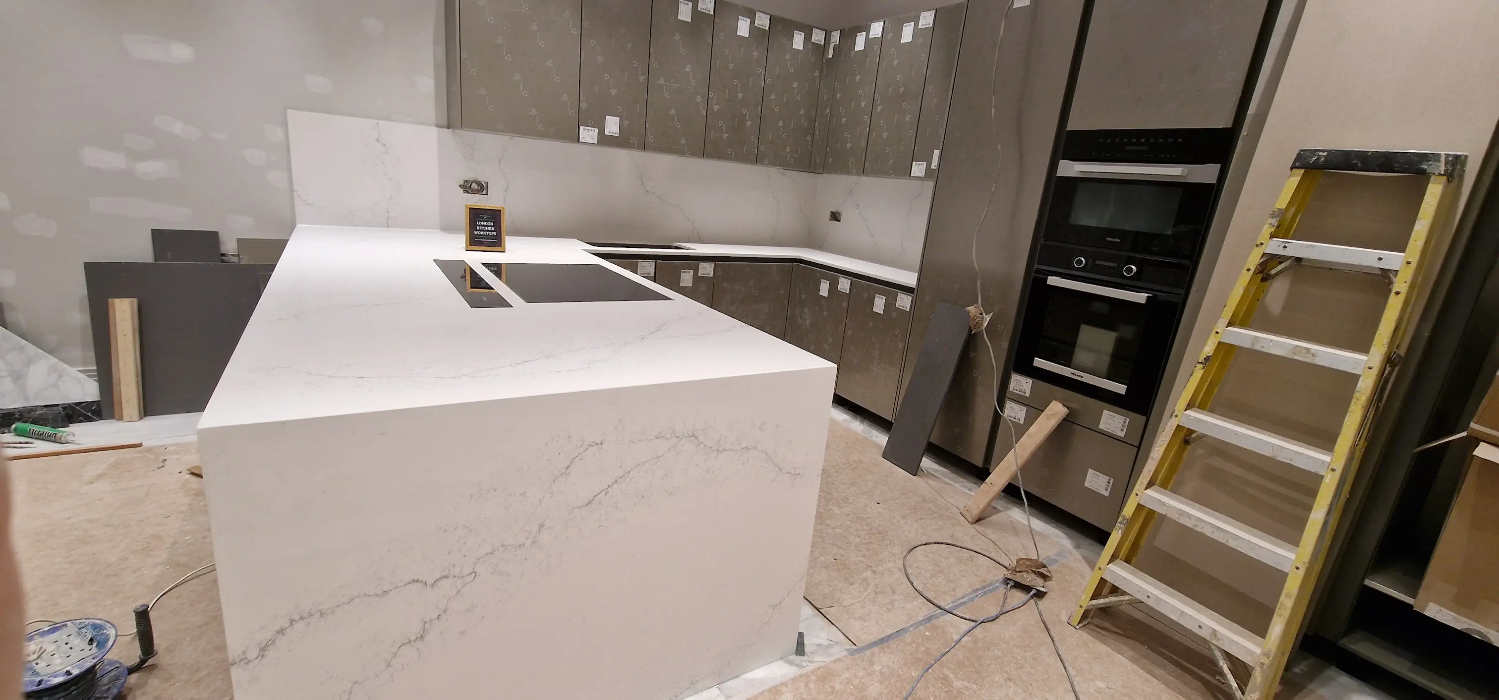 Quartz Waterfall Island in Reigate Quartz waterfall island fitted in a Reigate open-plan kitchen