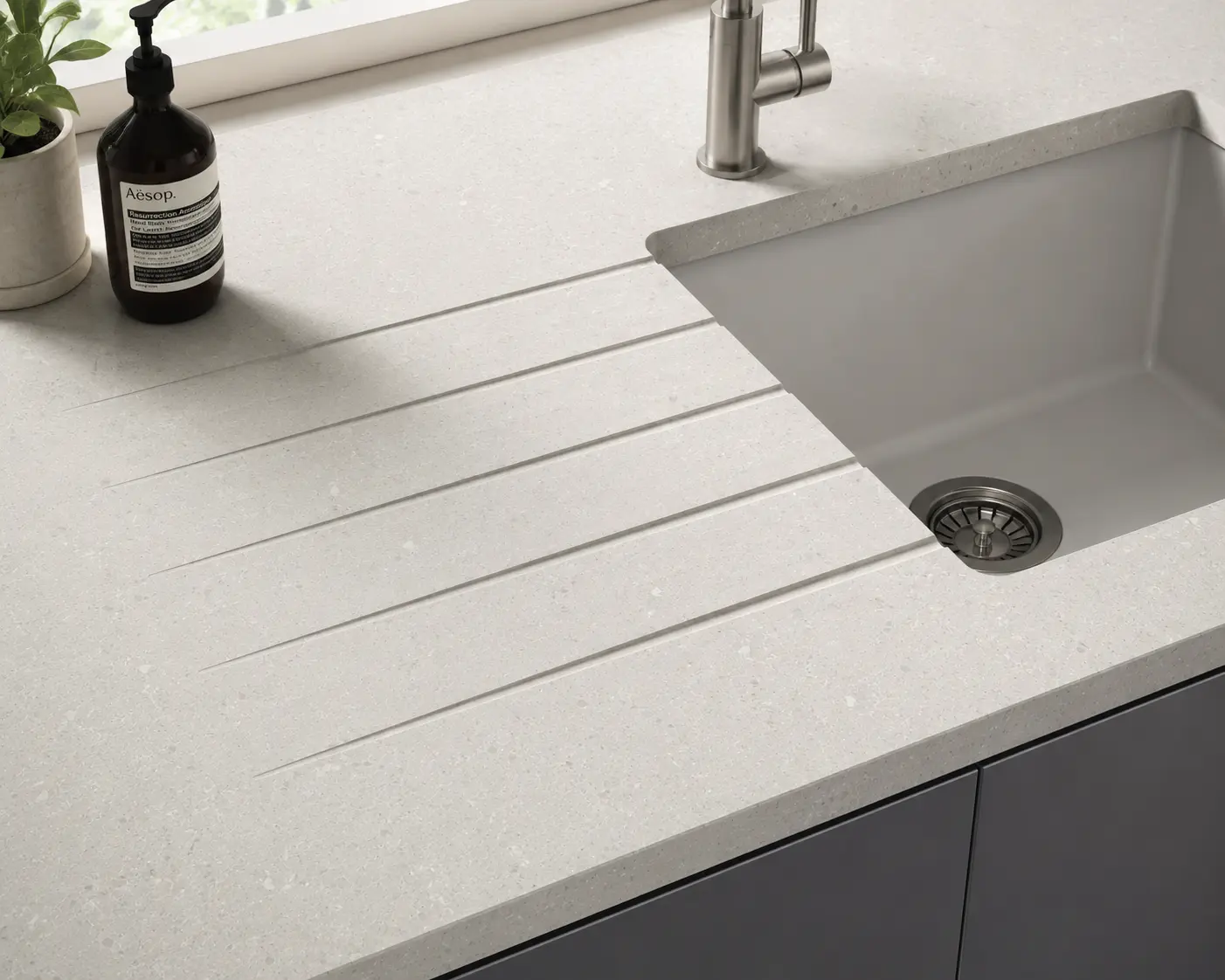 Quartz Sink Run Sutton Quartz sink run with drainer grooves and inset sink in a Sutton kitchen
