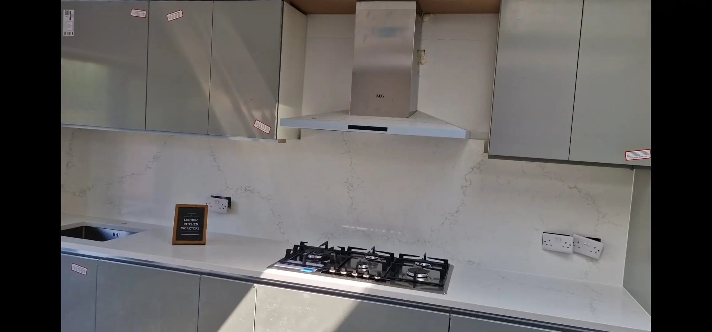 Quartz Worktops Sutton Apartment Grey quartz worktops fitted in a compact Sutton town centre apartment kitchen