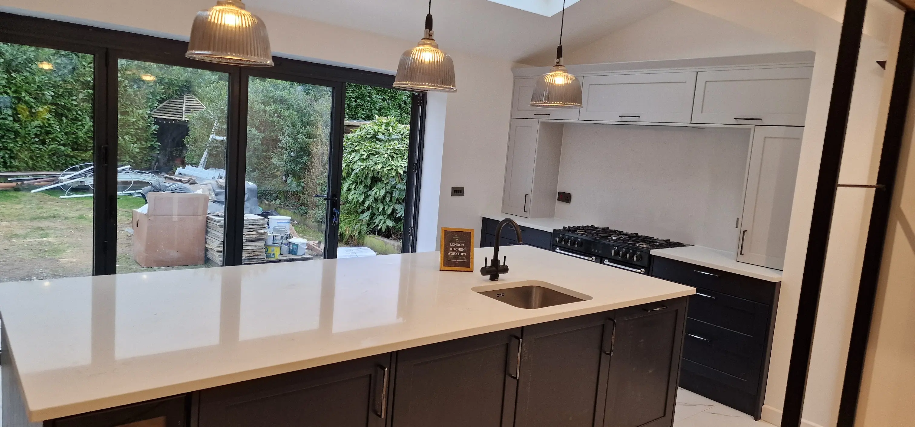 Modern quartz worktops in a Warfield kitchen with clean edge profile and upstand