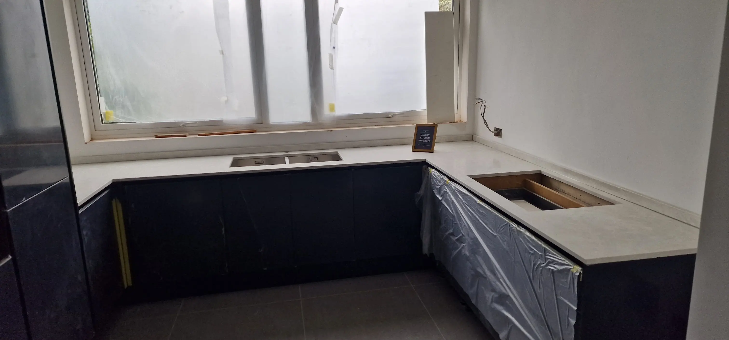 White Quartz Worktops for Wembley Flats White quartz worktops fitted in a Wembley flat kitchen