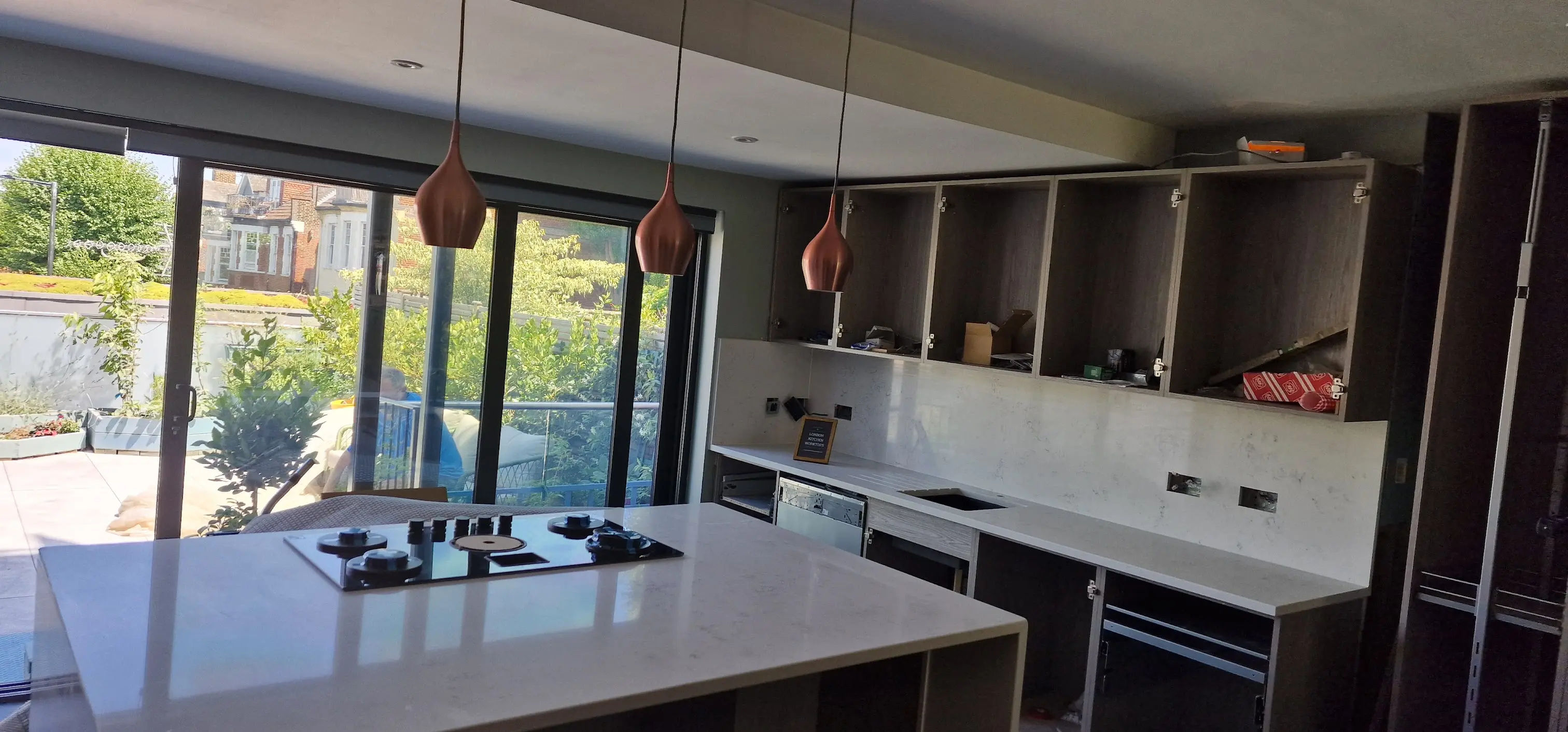 Open-plan family kitchen in Wokingham with quartz island and worktops