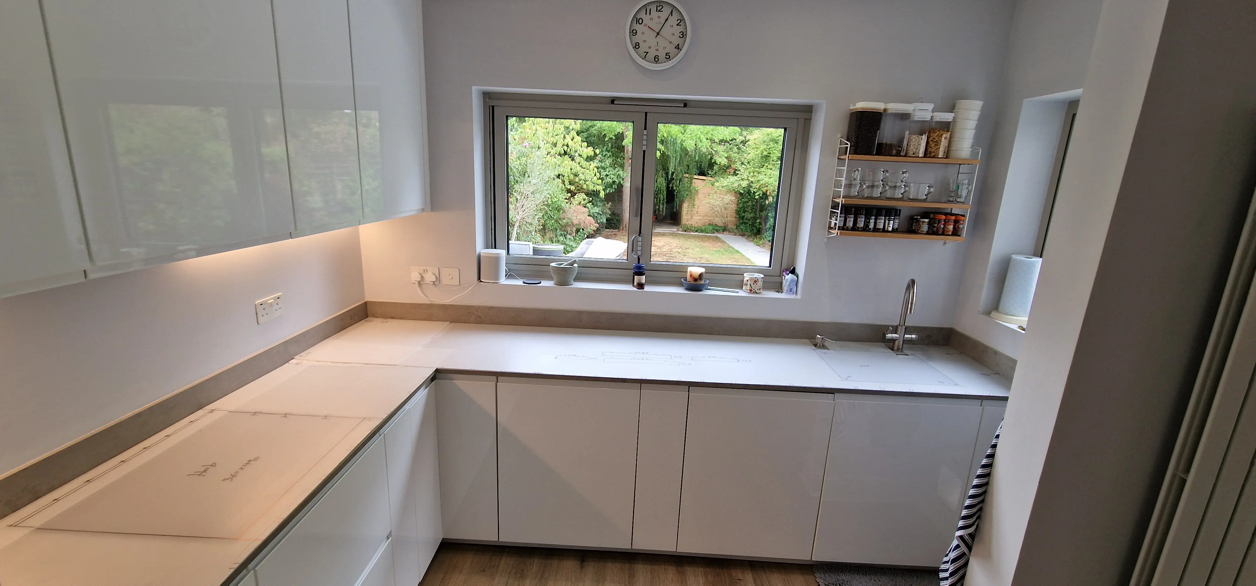 Replacement kitchen worktop templating around an existing London kitchen