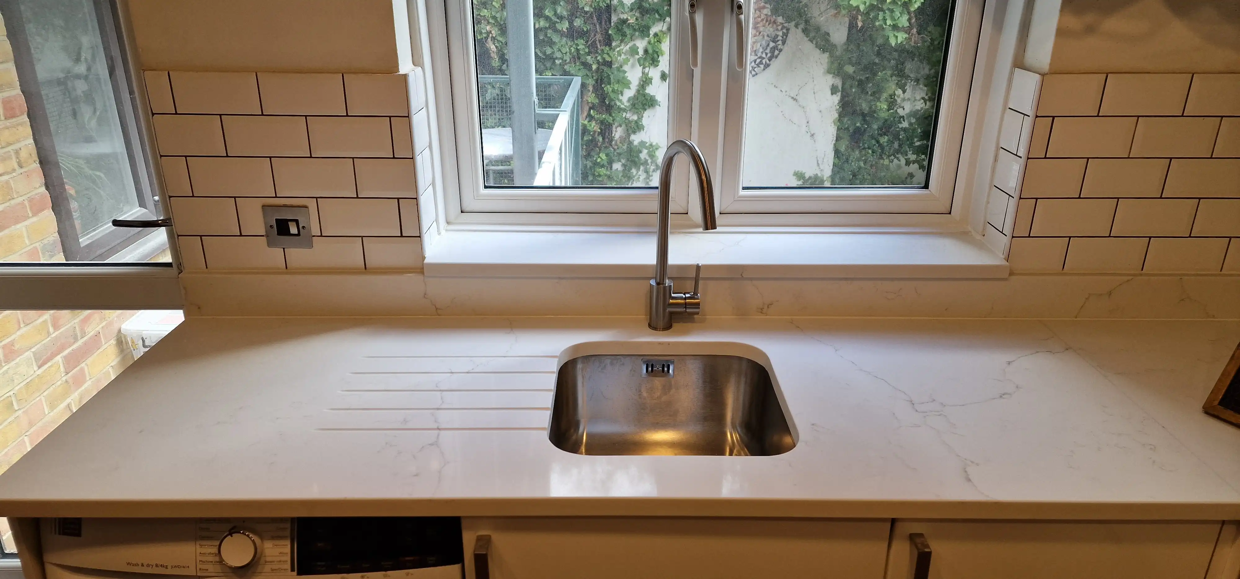 Replacement quartz sink cut-out Replacement quartz worktop with fabricated sink cut-out and drainer detail