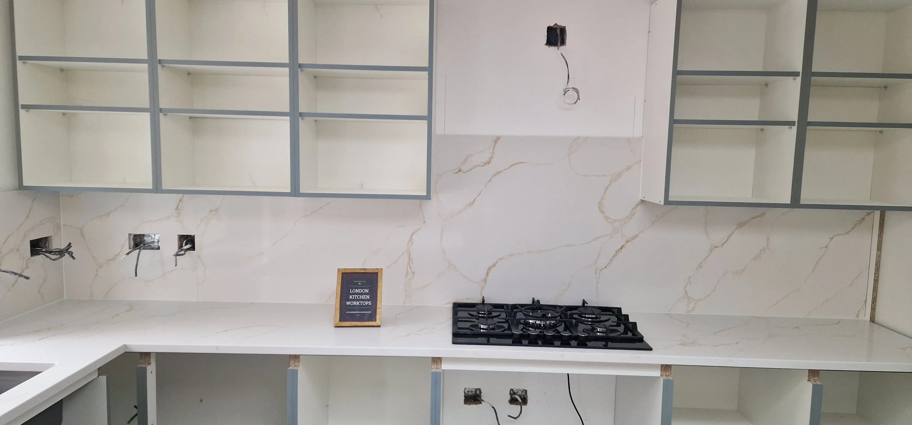 White quartz worktops brightening a Northolt kitchen with matching upstands