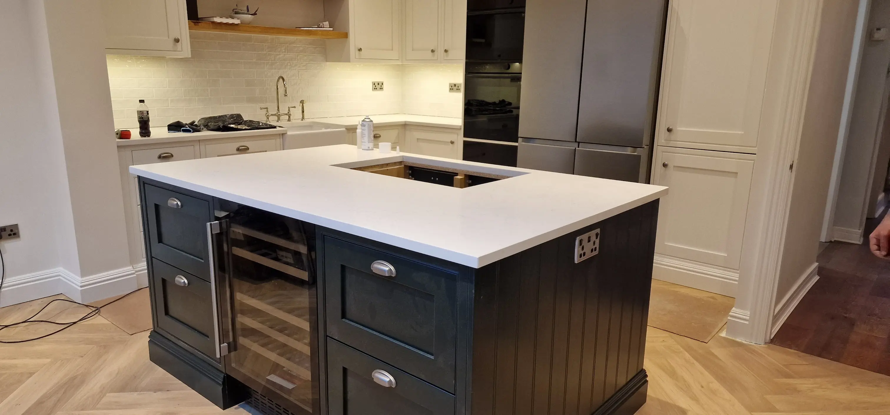 White quartz worktops in a bright Raynes Park family kitchen