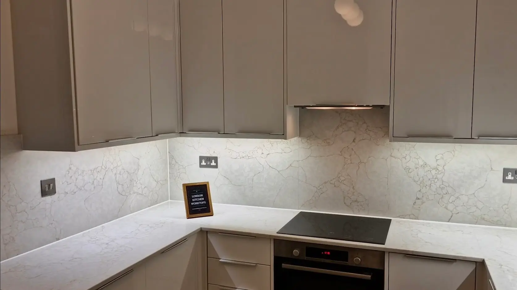 Finished stone worktop replacement with splashbacks in an Ealing kitchen