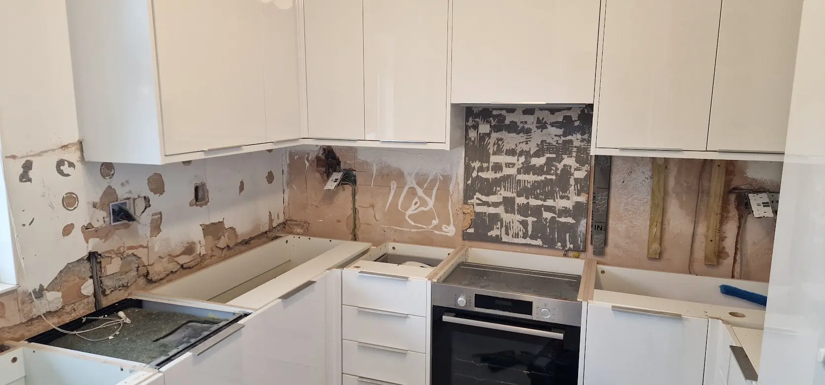 Existing kitchen prepared for stone worktop replacement in Ealing