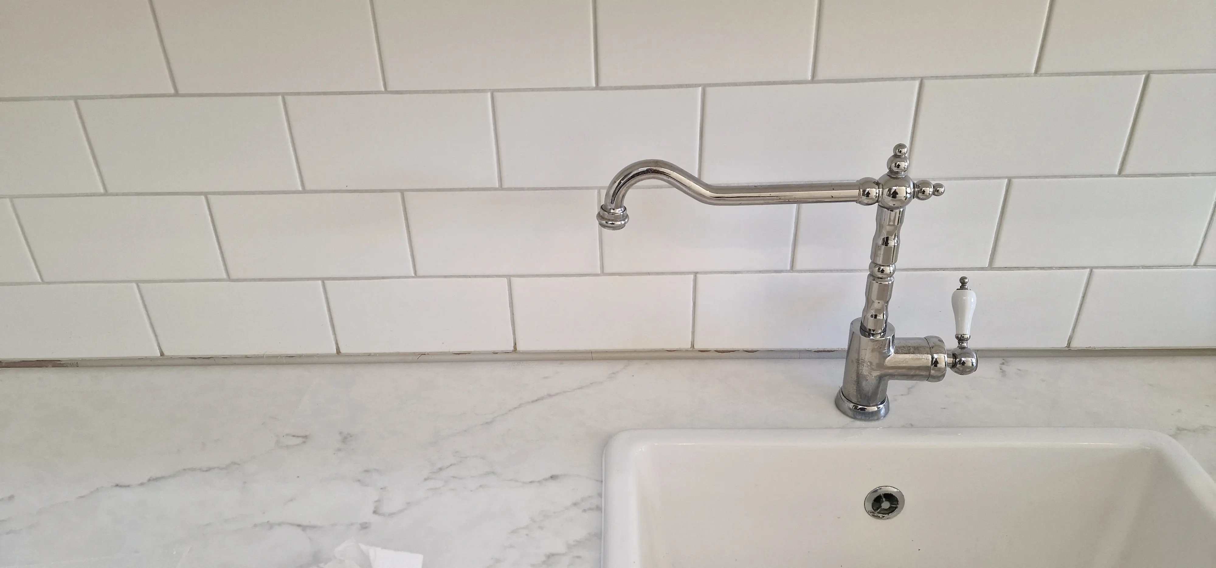 Gap exposed below existing kitchen tiles after changing to a thinner replacement worktop